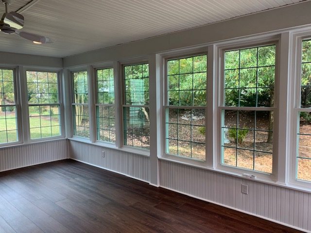 Corner room lined with double-hung windows