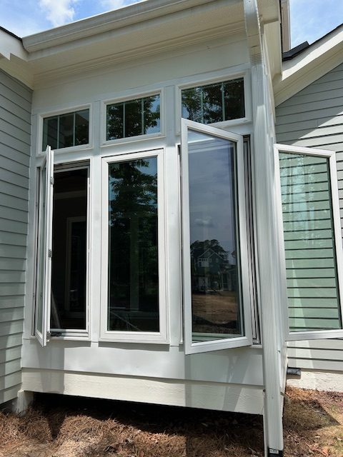 Projecting window unit with casement windows cranked open