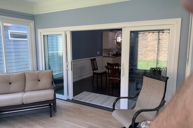 Bright room with sliding glass doors and large windows