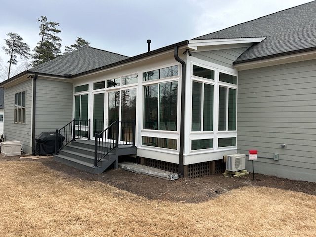 Exterior of a room with sliding and picture windows