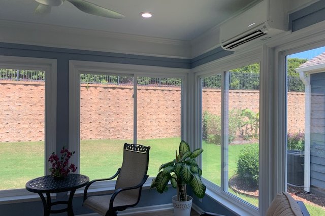 Sunny room with walls of windows