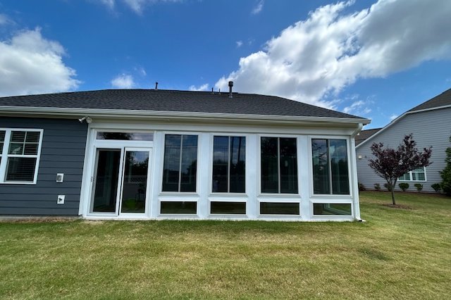 Sunroom addition across the back of a one-story home