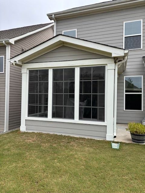 Home addition with three large gridded windows